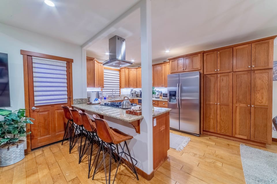 Kitchen area with bar seating.