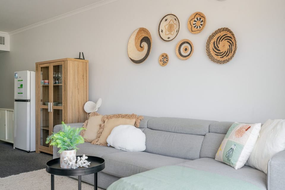 Modern living space with cozy seating and natural textures