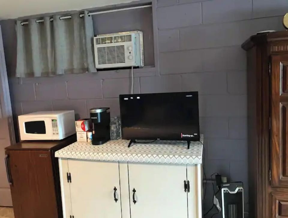 A/C, microwave, mini fridge, Keurig, TV and storage for your luggage