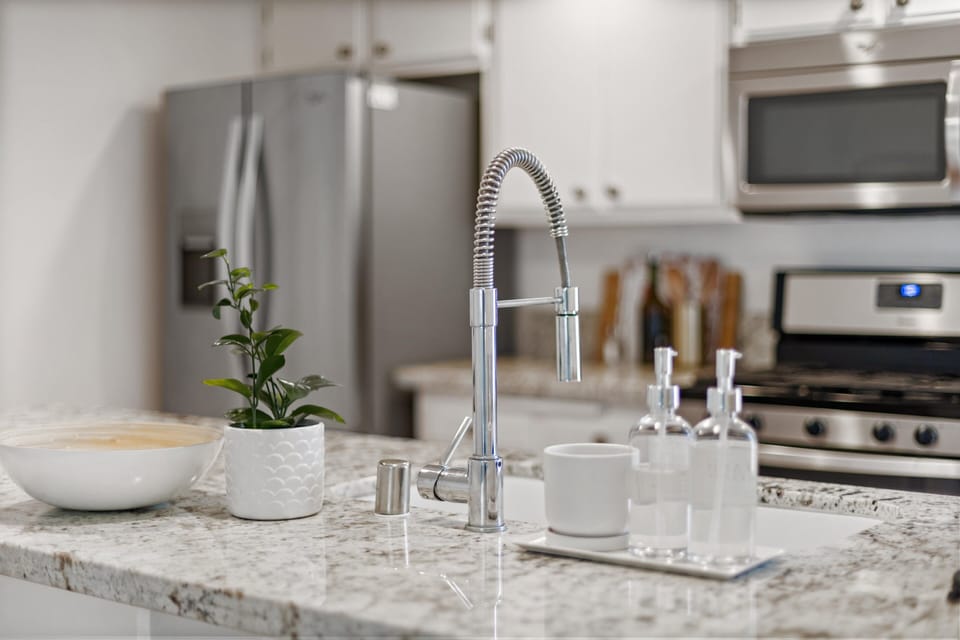 Lovey granite counters and a farm sink