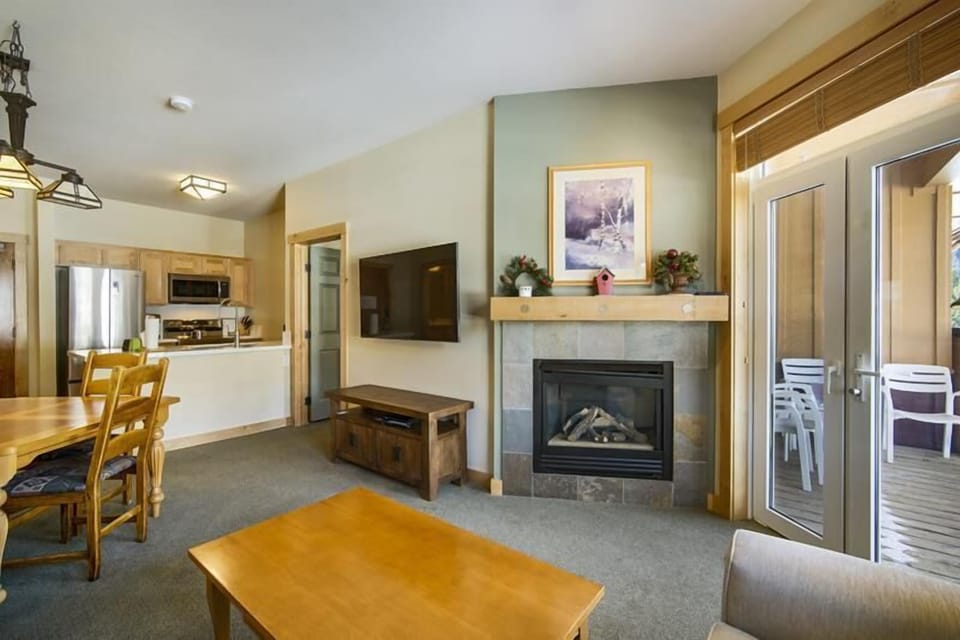 Fireplace and private deck in this amazing condo.