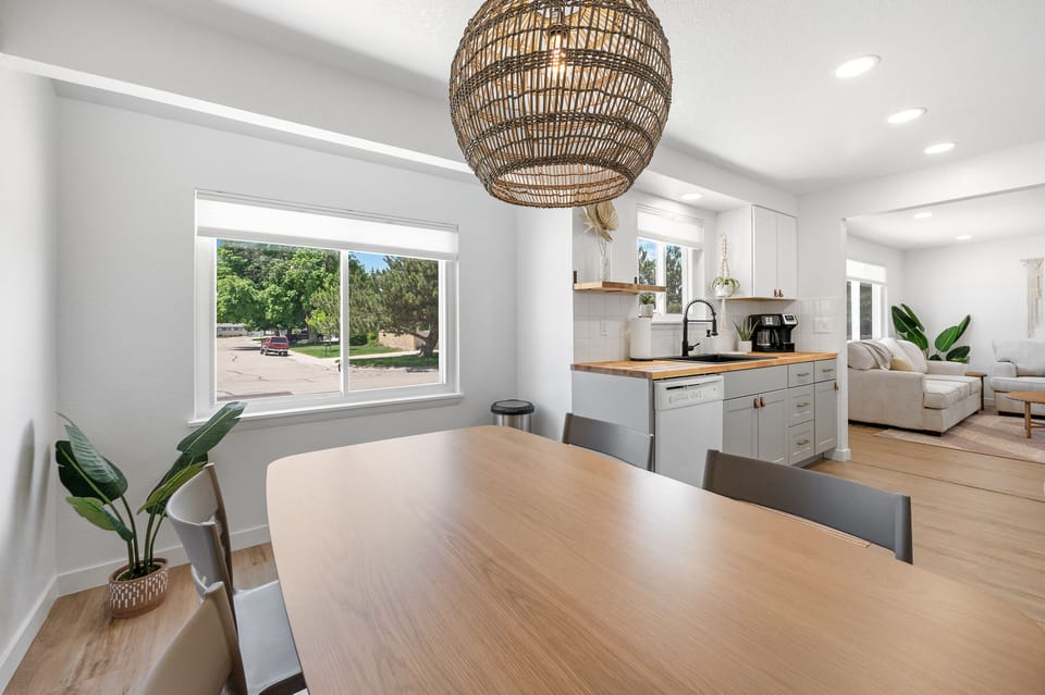 The BOHO wicker chandler pulls in the decor above the dining table which seats 4