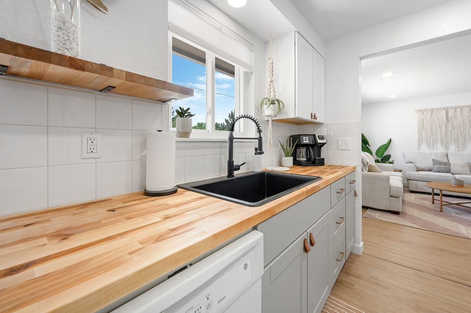Open shelving & natural wood tones make for an enjoyable kitchen experience 