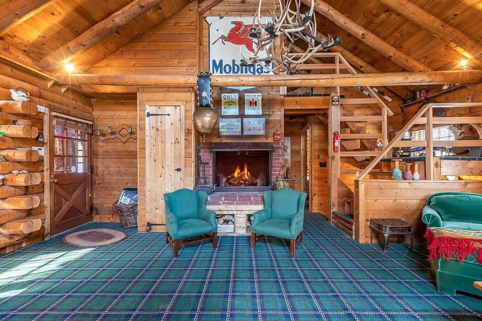 main level living room with wood burning fireplace