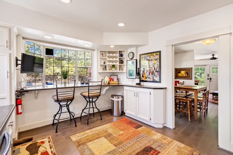 Settle in at the bar while sunlight fills the kitchen