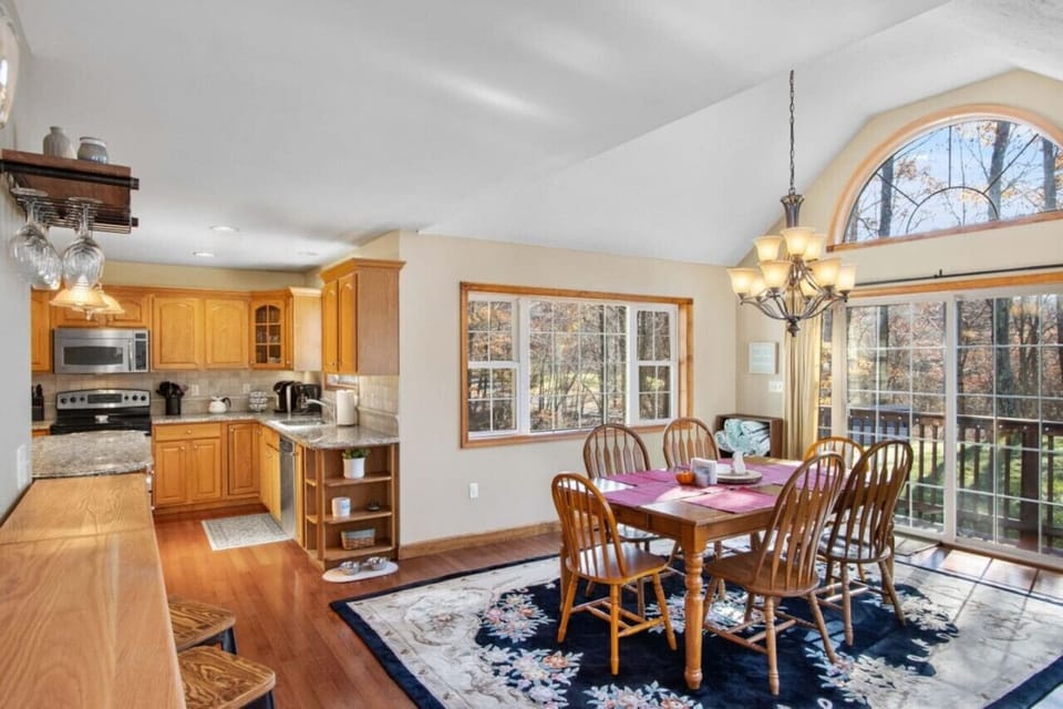 **Dining Room**  Whether at the bar top, dining table, kitchen island you can enjoy a quick snack to recharge and stay in the center of the family fun.