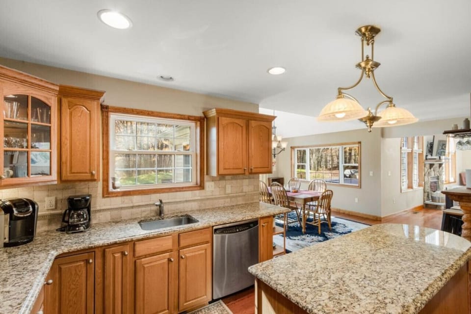**Kitchen** Gather around the island, sit at the dining table or venture to eat out on the deck. You`ll have plenty of options for your family meals whether full sit down or a quick bite before heading out for the day.