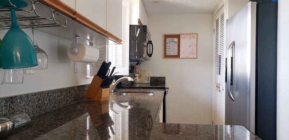 Updated kitchen with granite countertop and full sized washer and dryer. 