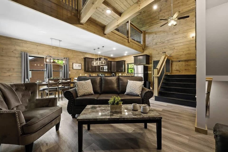 Spacious living room with warm brown tones, perfect for relaxing and cozying up.