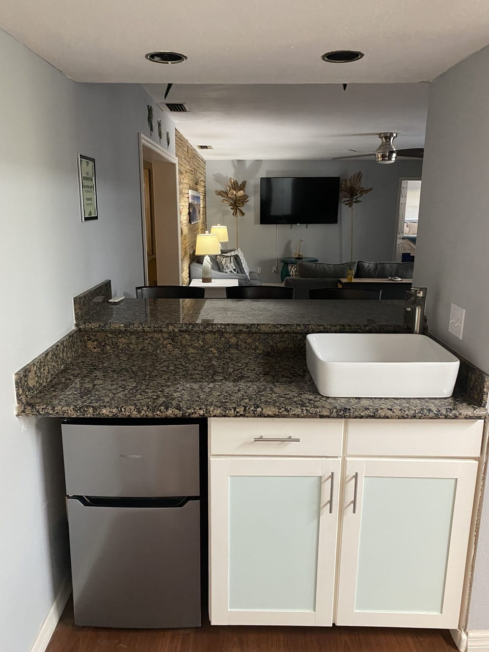 Indoor bar area with wet bar sink for the bartenders.