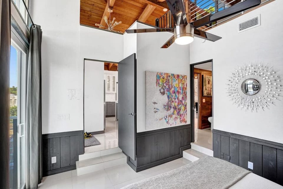 Note: Wall does not go up to the ceiling, and the secondary bedroom is visible from the loft