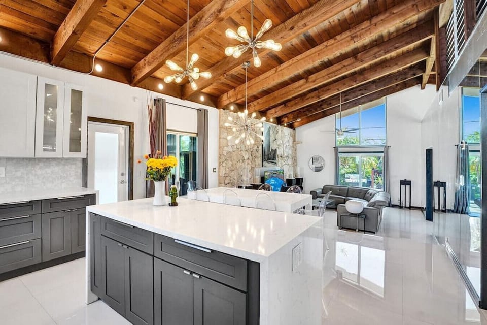 Completely open concept kitchen, dining, and living room with tons of natural light