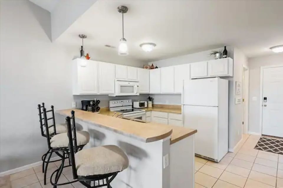Eat in kitchen is stocked w essentials for you.