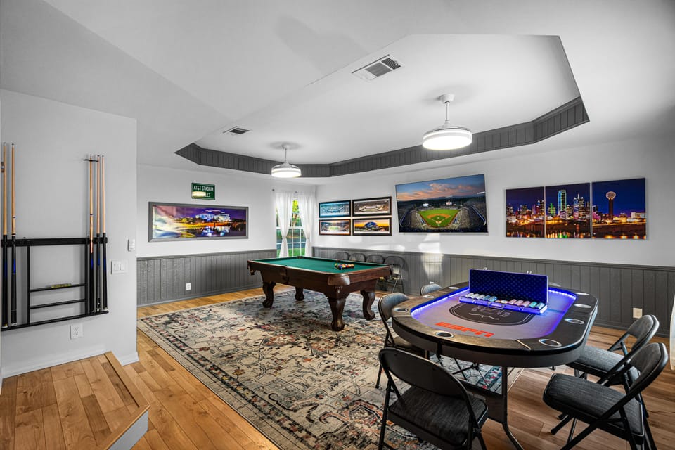 Huge game room with 75” TV, pool and poker tables