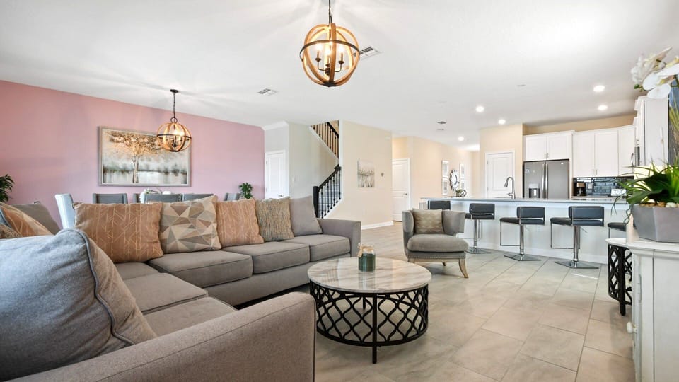 Spacious open-concept living area with stylish decor and seating!