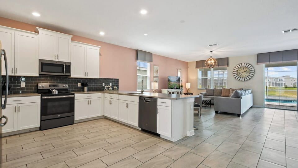 Spacious kitchen with modern appliances and open layout.