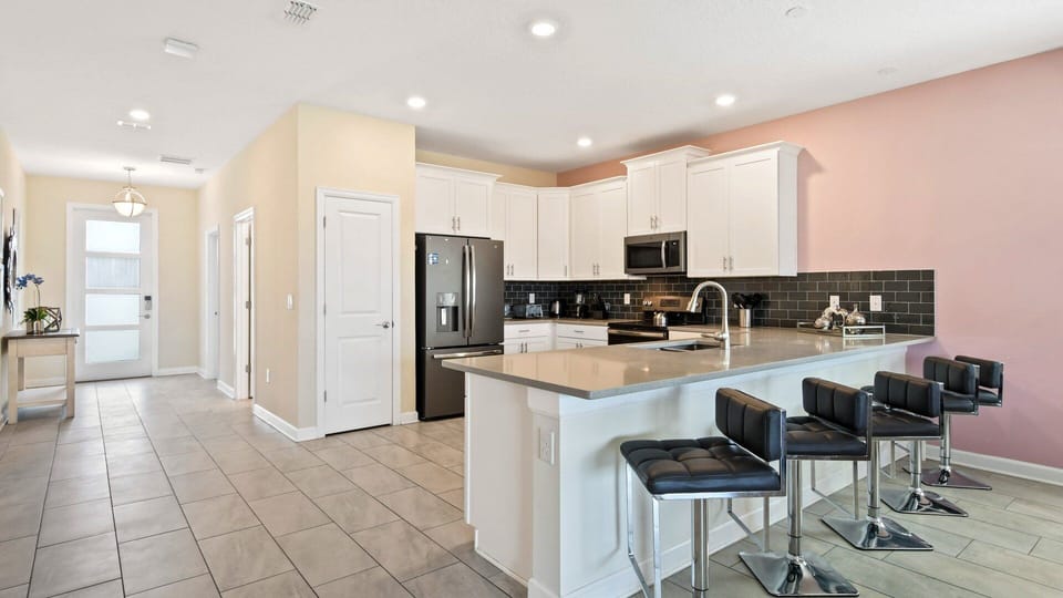 Sit up at the breakfast bar and keep the chef company