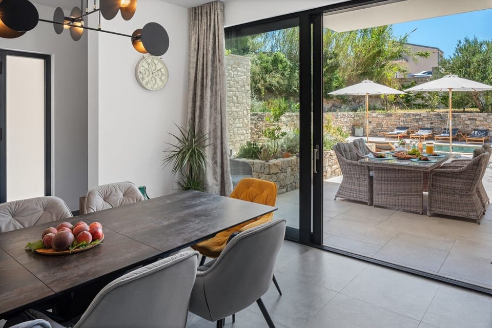 Dining area with an exit to the pool area
