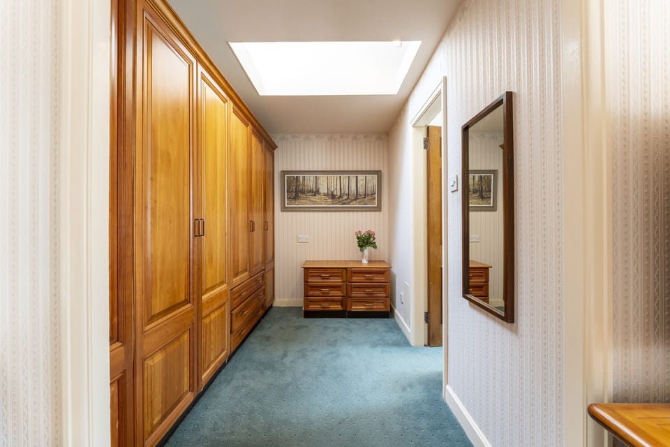 Dressing area with large fitted wardrobes