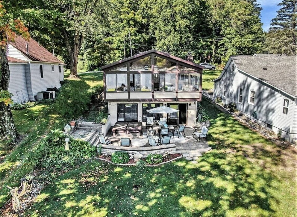 Lakeside view of house (pictured with previous patio furniture)