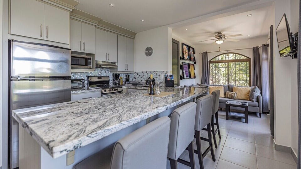 The 2nd floor of the home is a standalone apartment with a queen bed, full bathroom, Murphy bed and full kitchen and living space with Smart TV plus a stacked washer/dryer.
