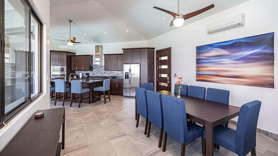 The home's layout provides amazing views from the open dining, kitchen and living spaces.  