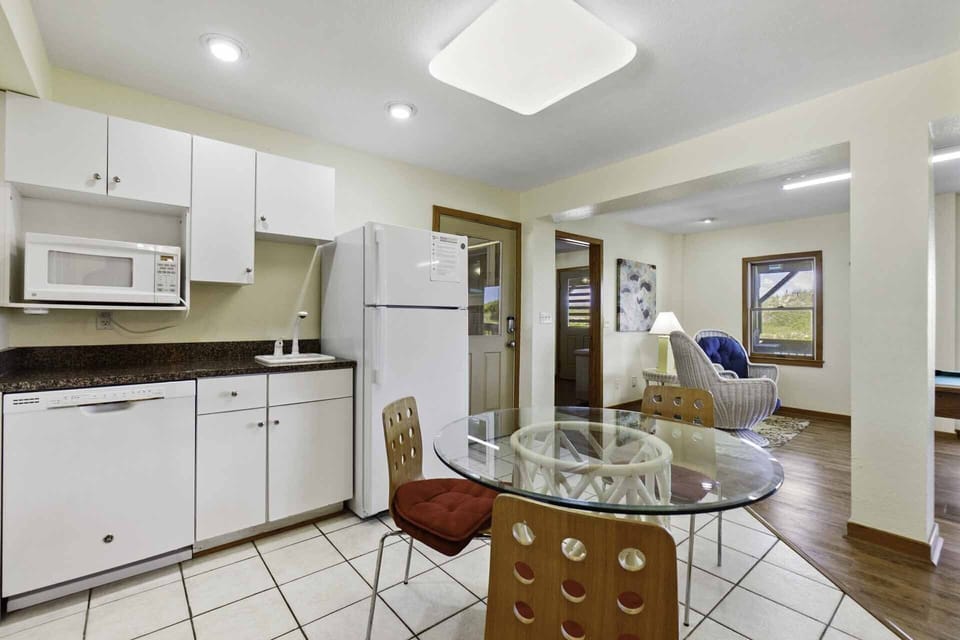 A convenient kitchenette in the game room includes a full size refrigerator, dishwasher, sink, and microwave.