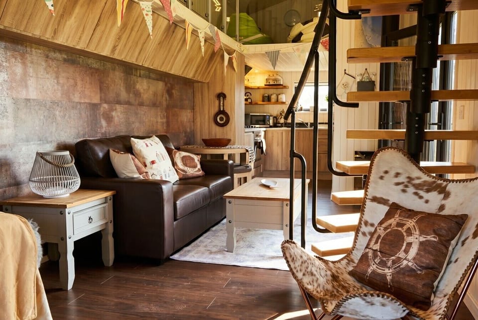 Furnished to a high standard with cosy seating and warm wood throughout.