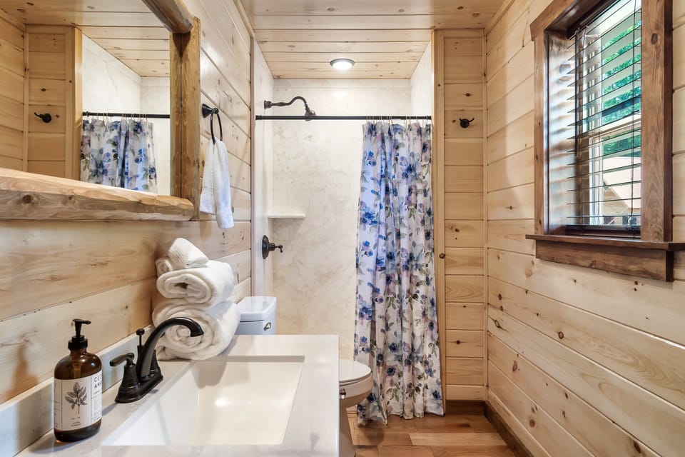 The "Bless Your Heart" bathroom has a walk in shower