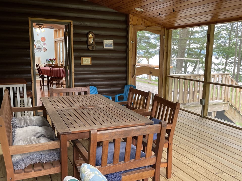 Screened room has overhead fan, plenty of lights, and perfect view of the lake