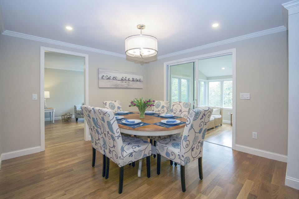 Dining area connects to kitchen, sunroom and living room.