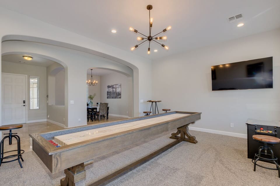 Game Room with shuffle board table, dart board, arcade table & 2 bistro tables