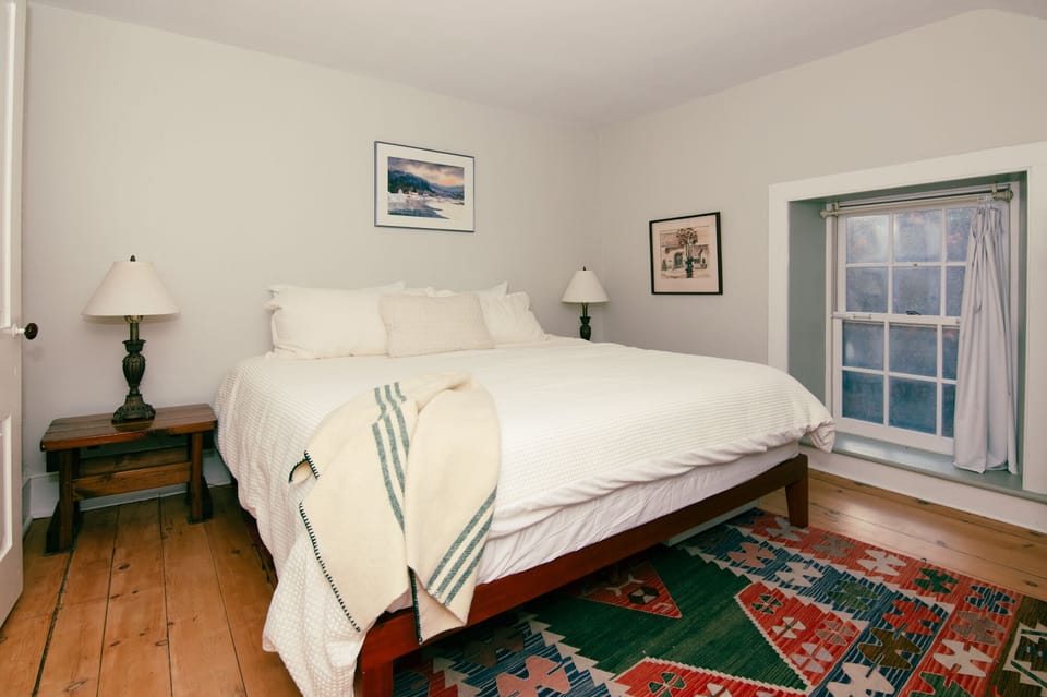 This room has a king-sized bed and a west-facing view of the countryside. 