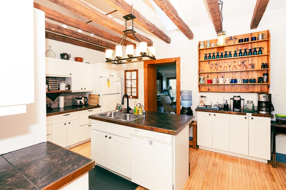 The kitchen retains the original lofted beams.  It's well stocked for cooking.  