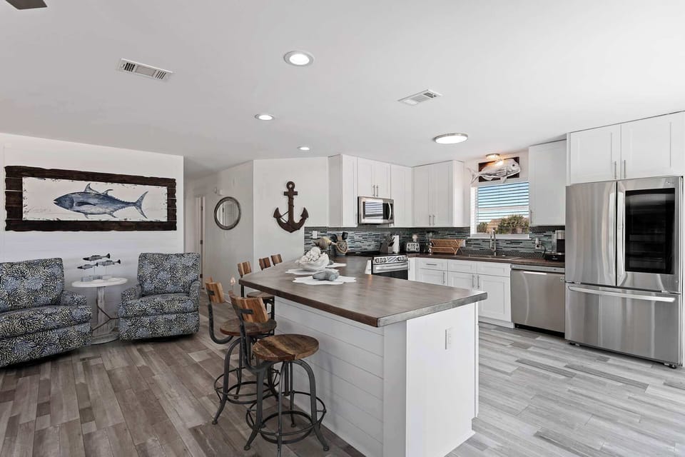 Kitchen & dining space w/ bar seating and an easy, social layout