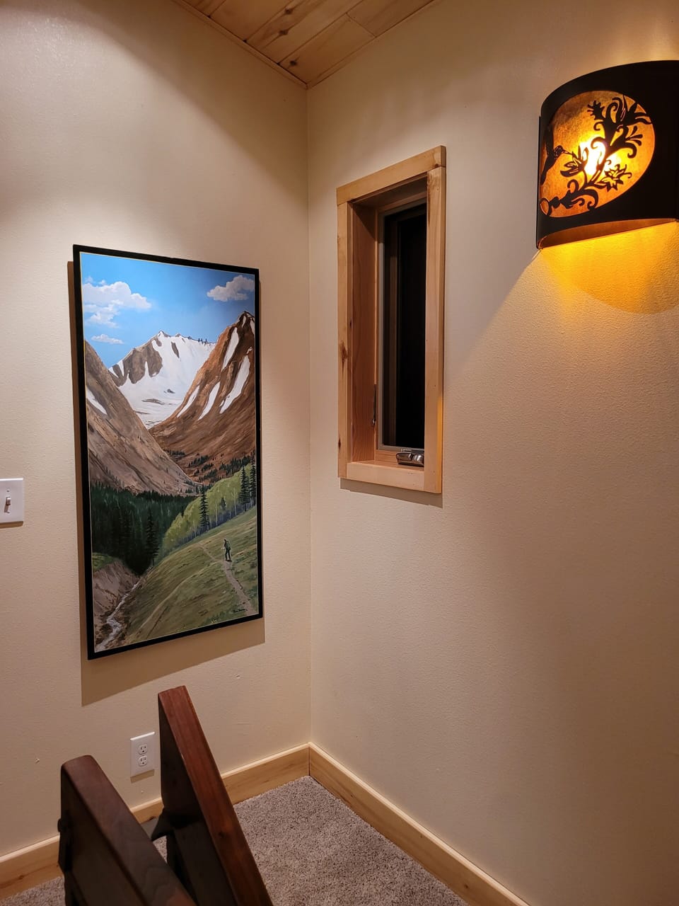 Top of stairs artwork, and window for a view.