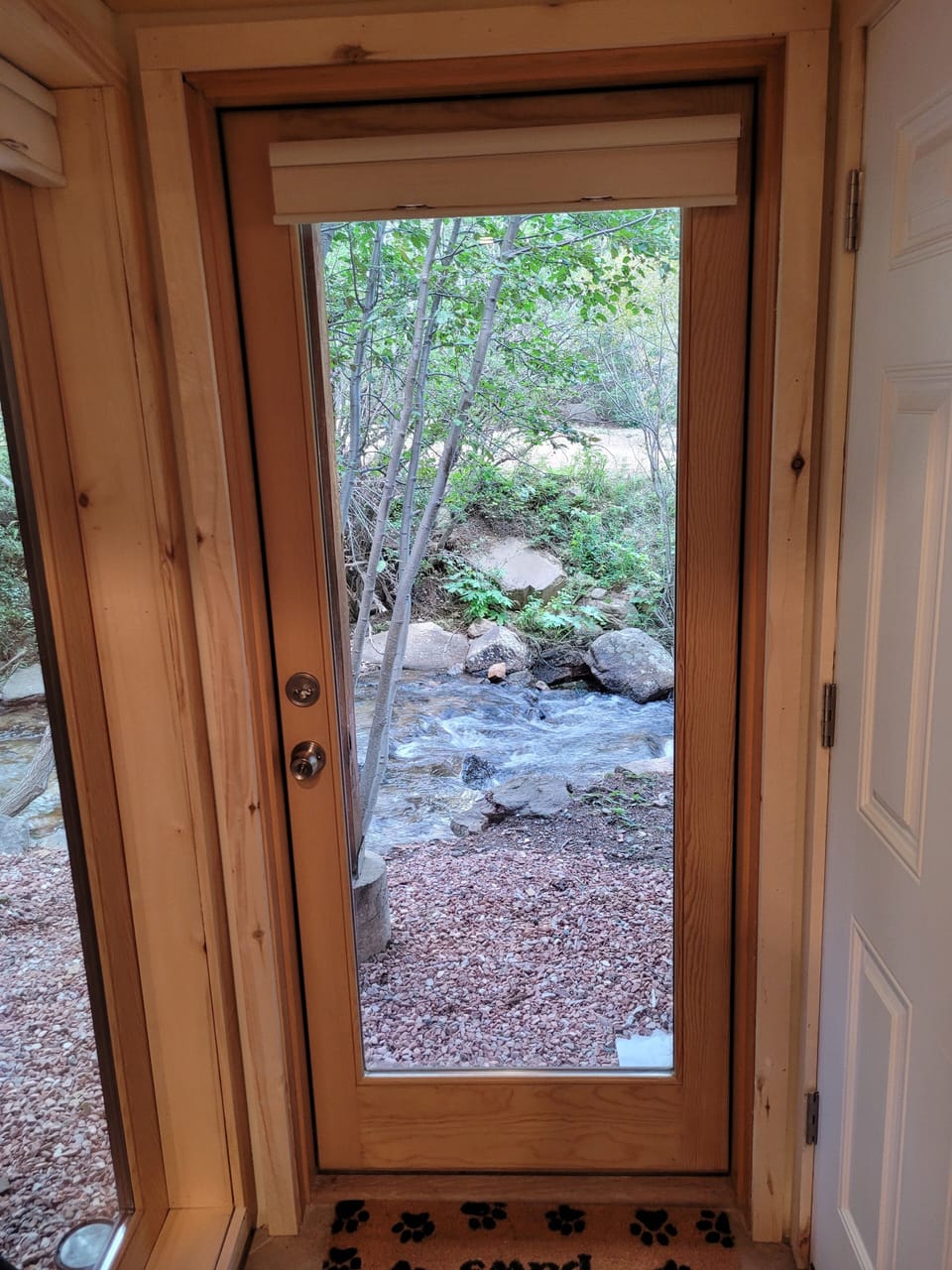 Stream-side exit and wood storage access.
