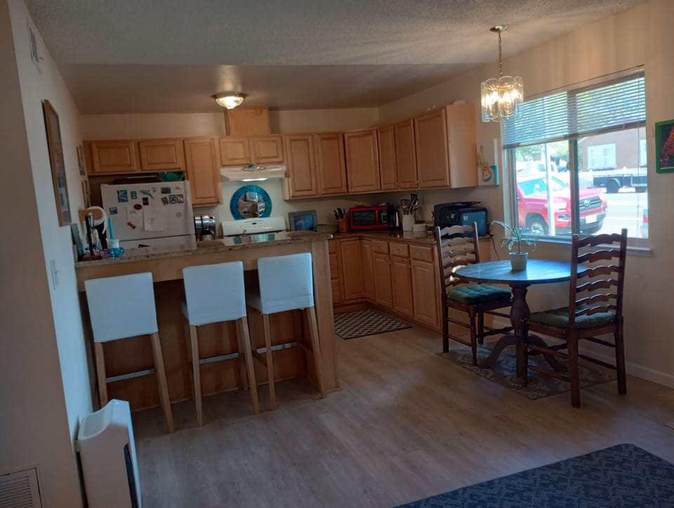 Kitchen, breakfast bar, & dining area