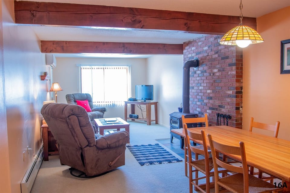 Living area has a 46-inch Flat Screen TV.
Dining area seats 6-8 comfortably.