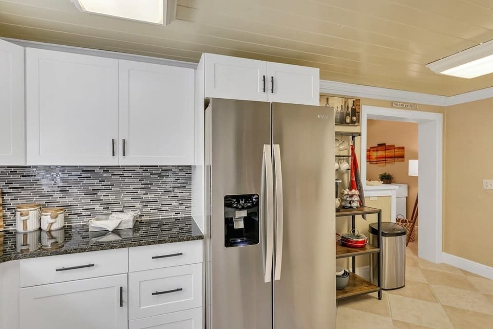 Beautifully clean & spacious kitchen with all new appliances! Stocked with everything you need for your stay & then some! Pots, pans, utensils, plates, bowls, wine glasses, coffee mugs, cups, blender, toaster, Keurig Duo k-cup & coffee maker & more!