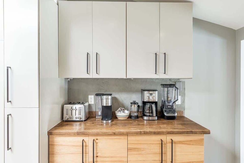 Full coffee corner with Keurig machine, drip coffee as well as a French press for even the most discerning coffee connoisseurs