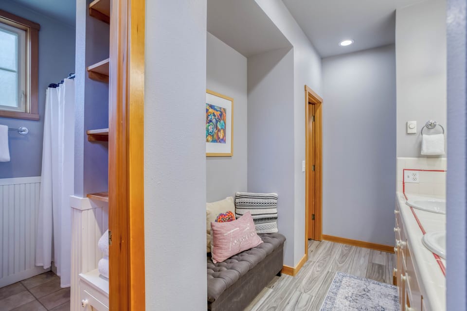 Bedroom 1- Bathroom with Sink and seating