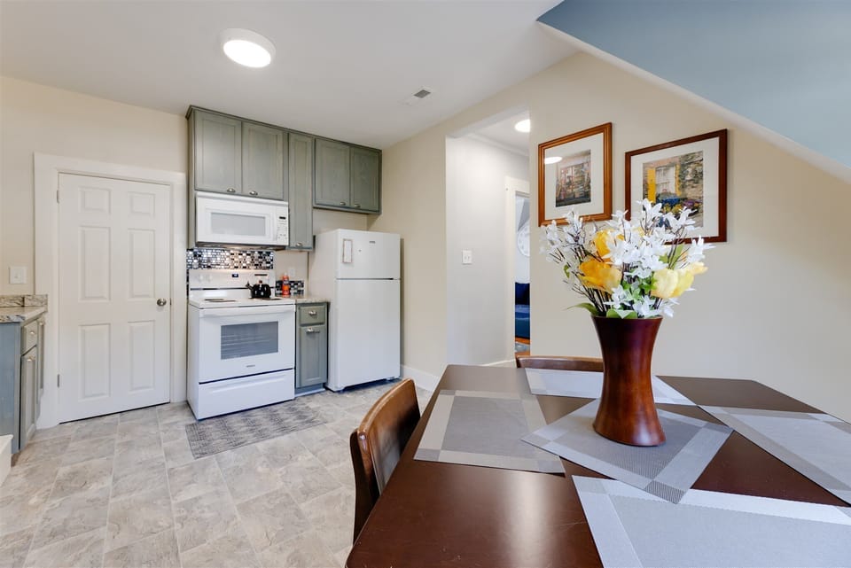 Eat-in kitchen includes comfortable seating for three. 