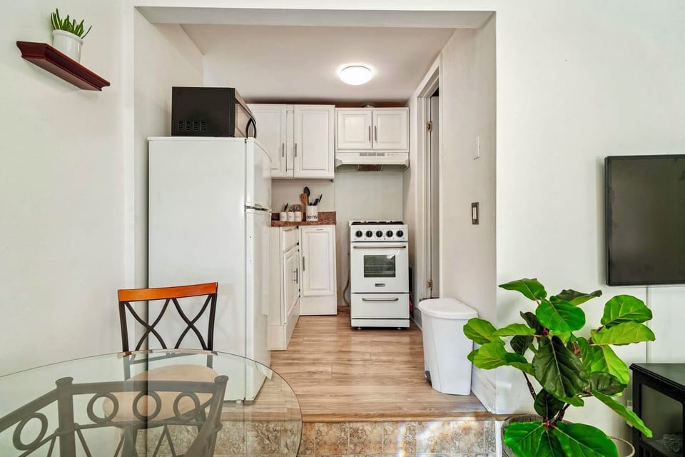 Kitchen, to the right leads to bathroom