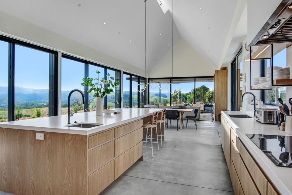 Kitchen + great room view looking south. All the doors slide open.