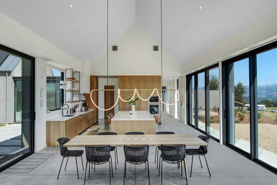 Dining table with a dramatic LED rope light fixture.