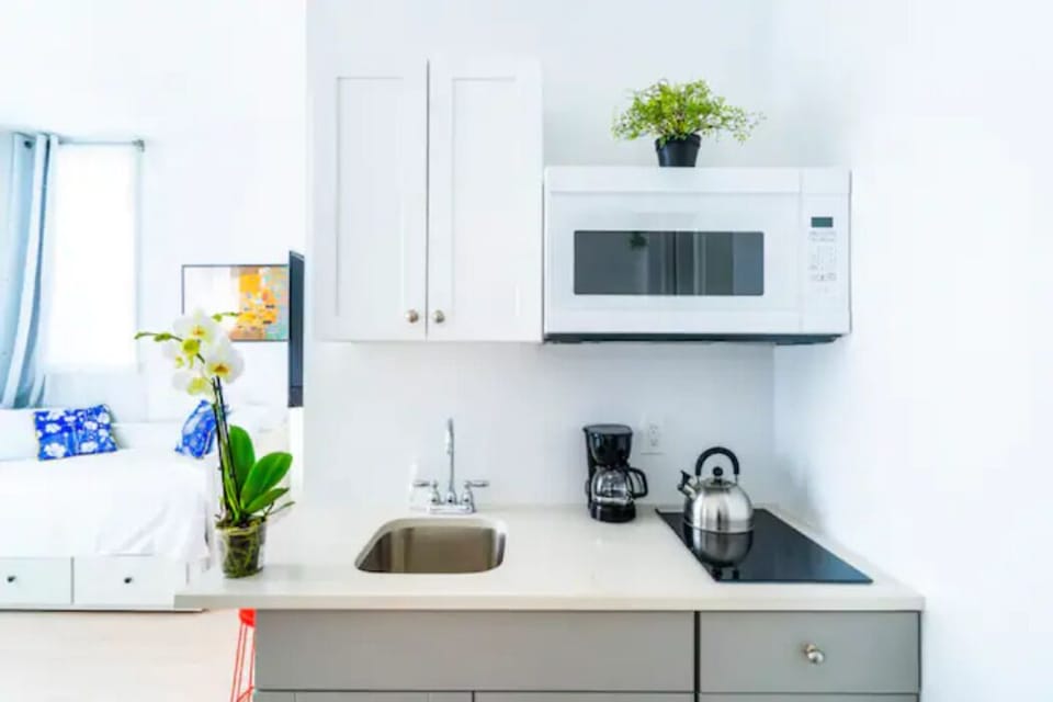 Full Kitchen has a 2-range Electric Stove, Microwave, Refrigerator