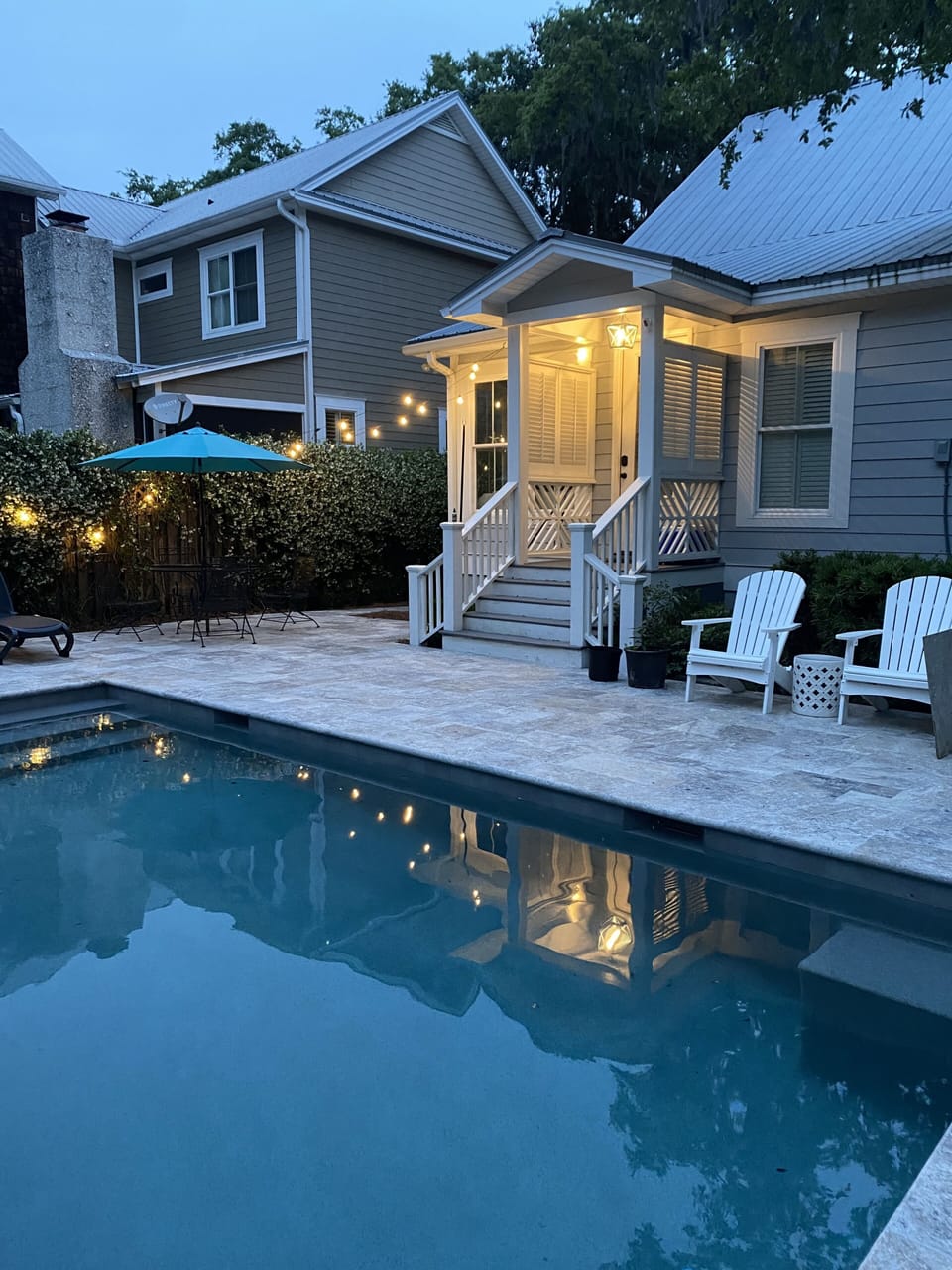Pool area includes Patio Table/Three Umbrellas and Natural Gas Grill.
