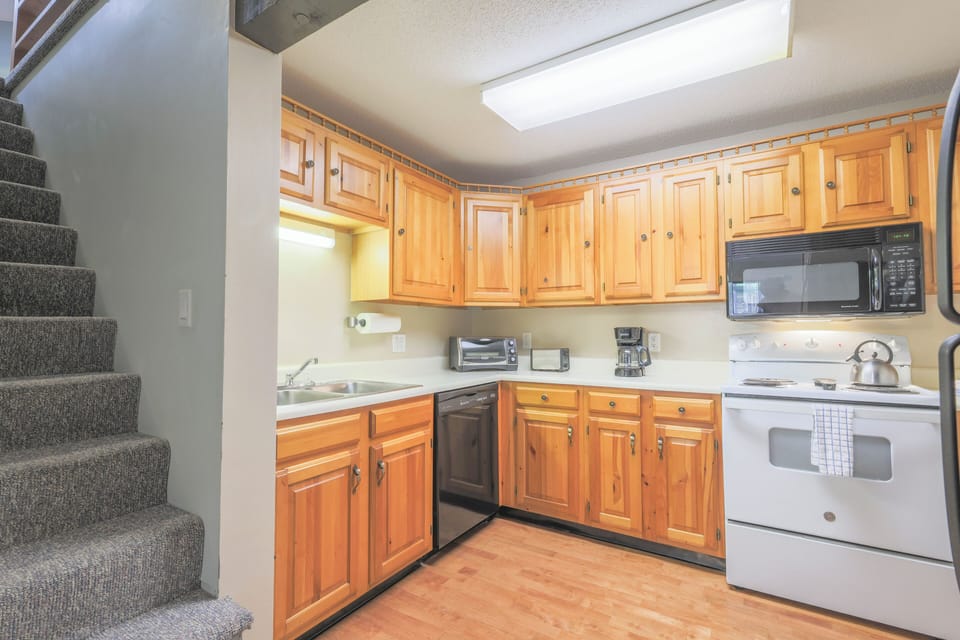 Kitchen is fully stocke with pot & pans, glassware, dishware, flatware and cooking utensils
