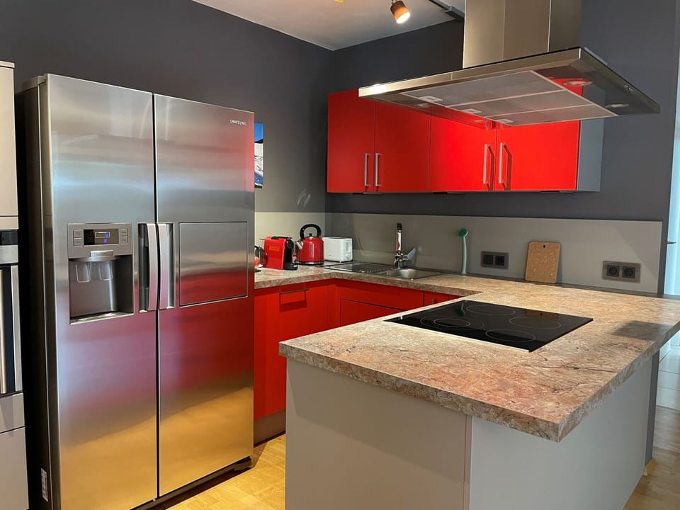 Countertop, Cabinetry, Property, Kitchen Appliance, Kitchen, Kitchen Stove, Sink, Lighting, Wood, Interior Design